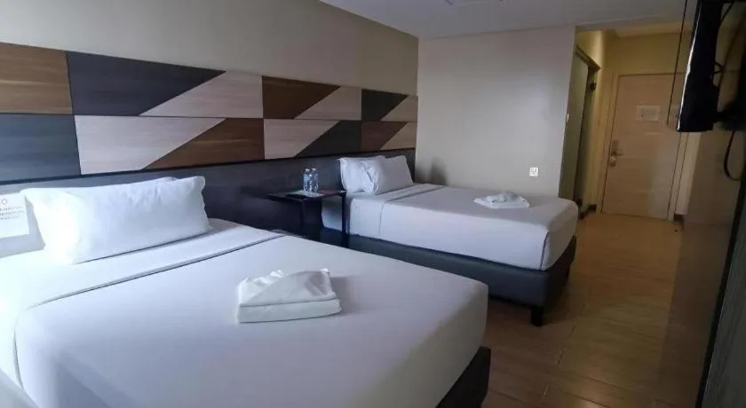 Bed in Travelite Hotel Legarda