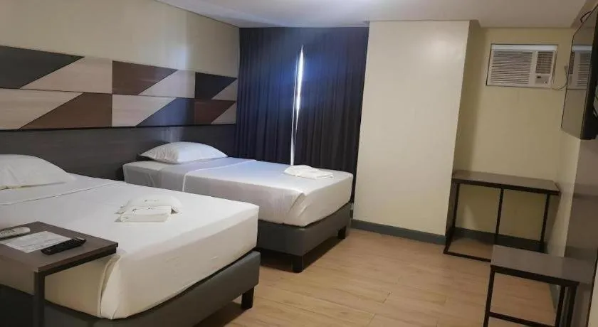 Bed in Travelite Hotel Legarda
