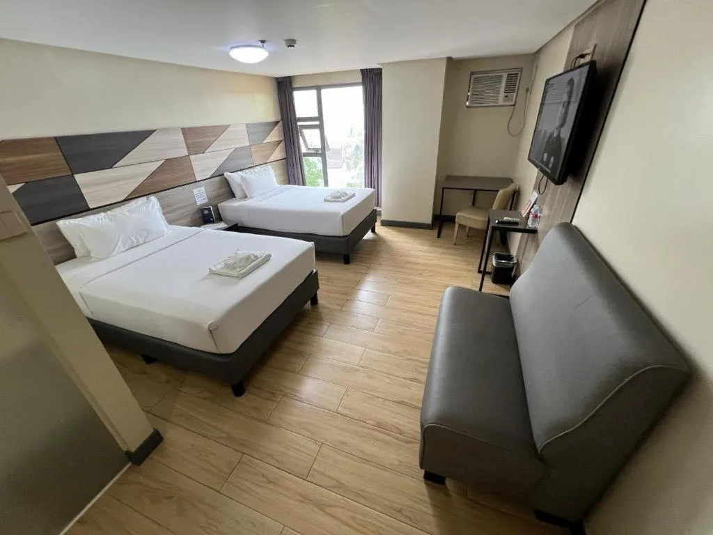 Bed in Travelite Hotel Legarda