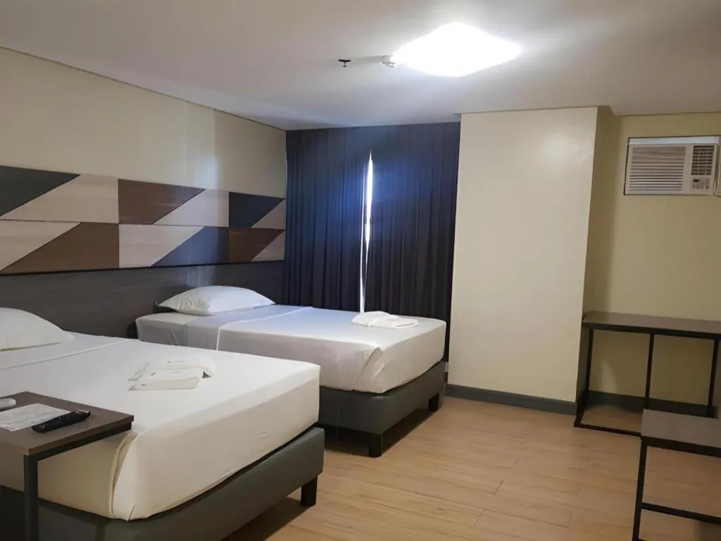 Bed in Travelite Hotel Legarda