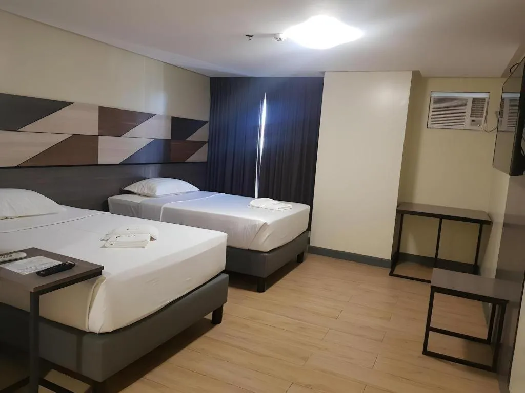 Bed in Travelite Hotel Legarda