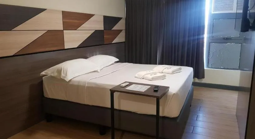 Bed in Travelite Hotel Legarda