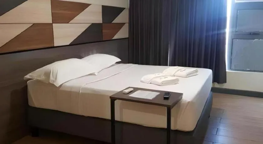 Bed in Travelite Hotel Legarda