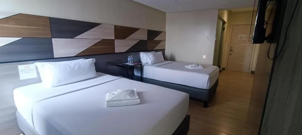 Bed in Travelite Hotel Legarda