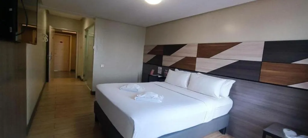 Bed in Travelite Hotel Legarda