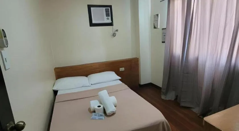 Bed in La Bella Casa Boracay Hotel