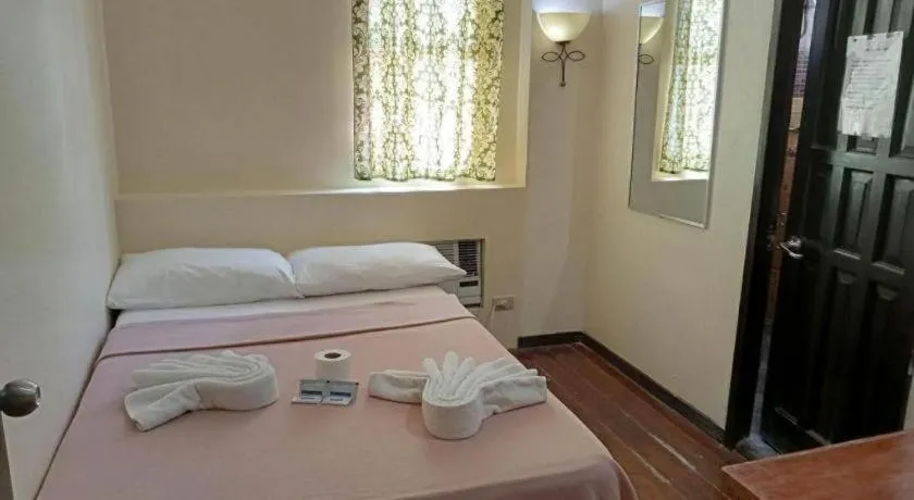 Bed in La Bella Casa Boracay Hotel