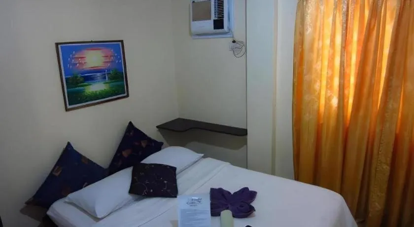 Bed in La Bella Casa Boracay Hotel