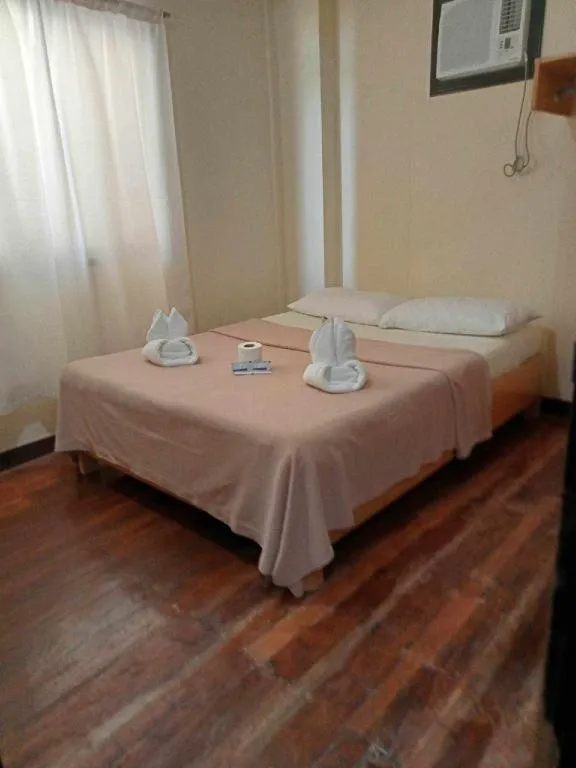 Bed in La Bella Casa Boracay Hotel