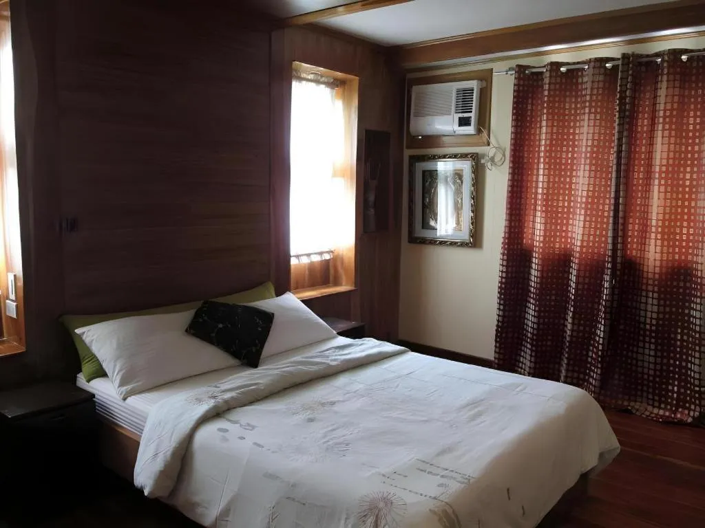 Bed in La Bella Casa Boracay Hotel