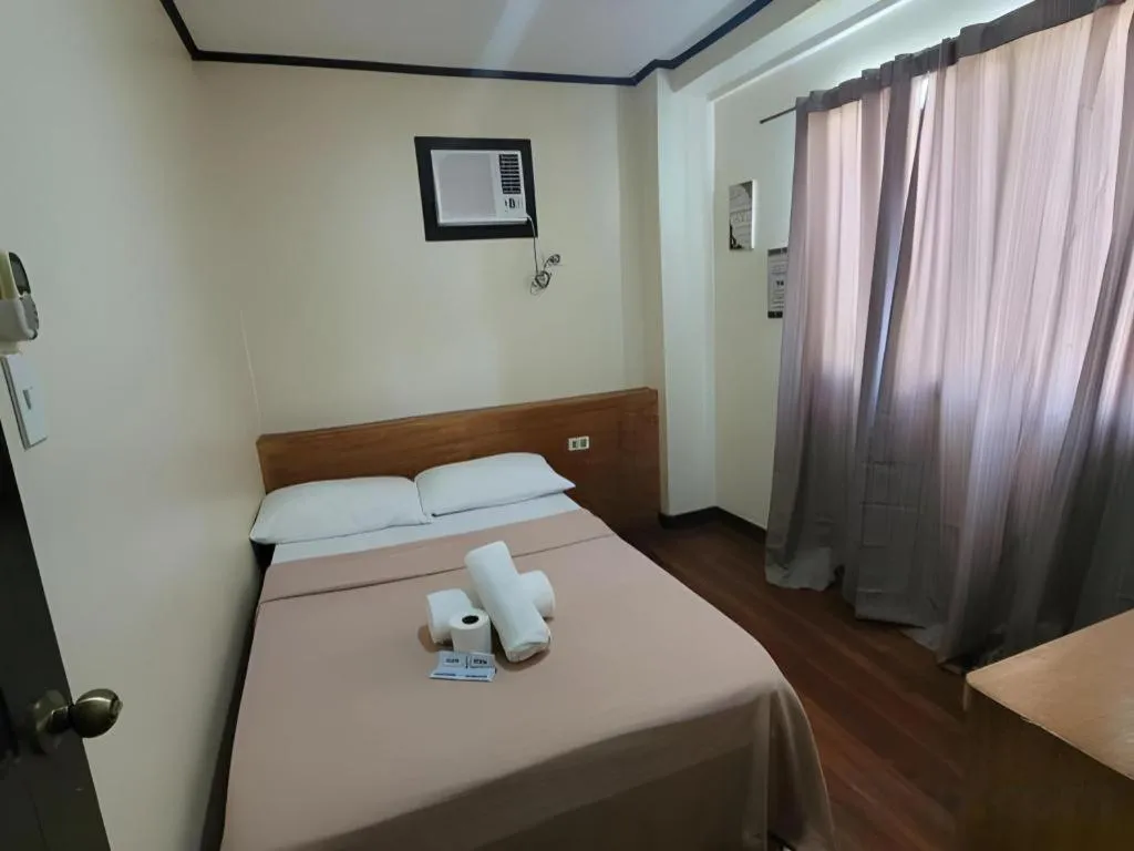 Bed in La Bella Casa Boracay Hotel