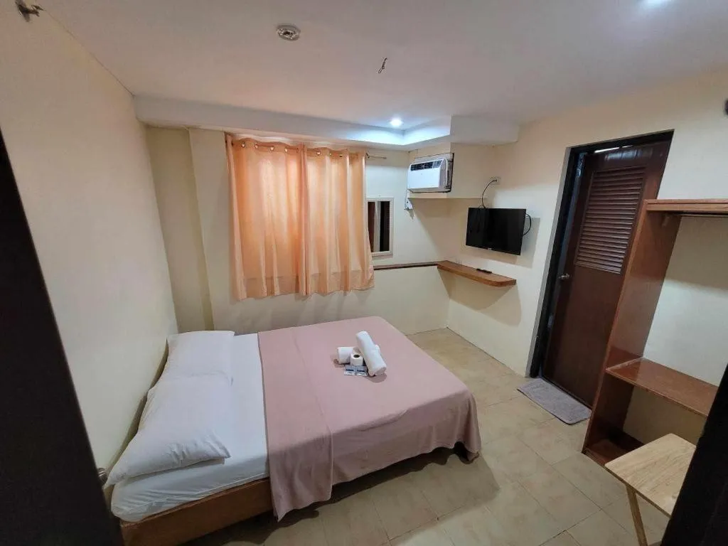 Bed in La Bella Casa Boracay Hotel