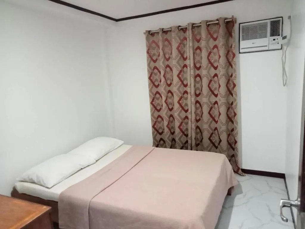 Bed in La Bella Casa Boracay Hotel