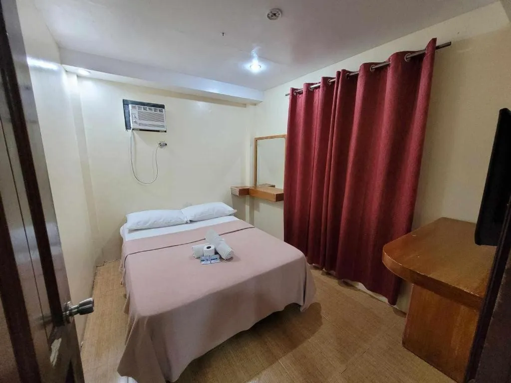 Bed in La Bella Casa Boracay Hotel