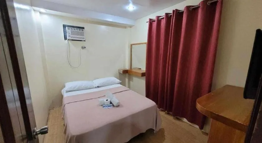 Bed in La Bella Casa Boracay Hotel