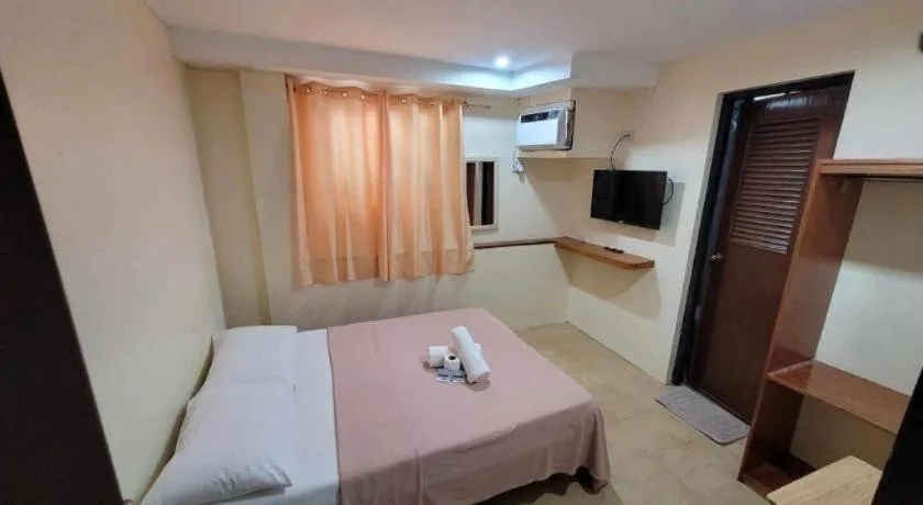 Bed in La Bella Casa Boracay Hotel