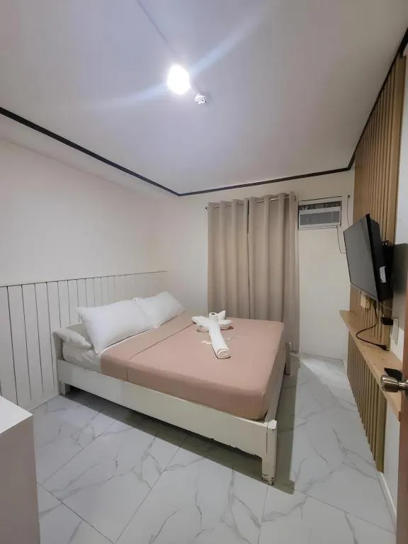 Bed in La Bella Casa Boracay Hotel