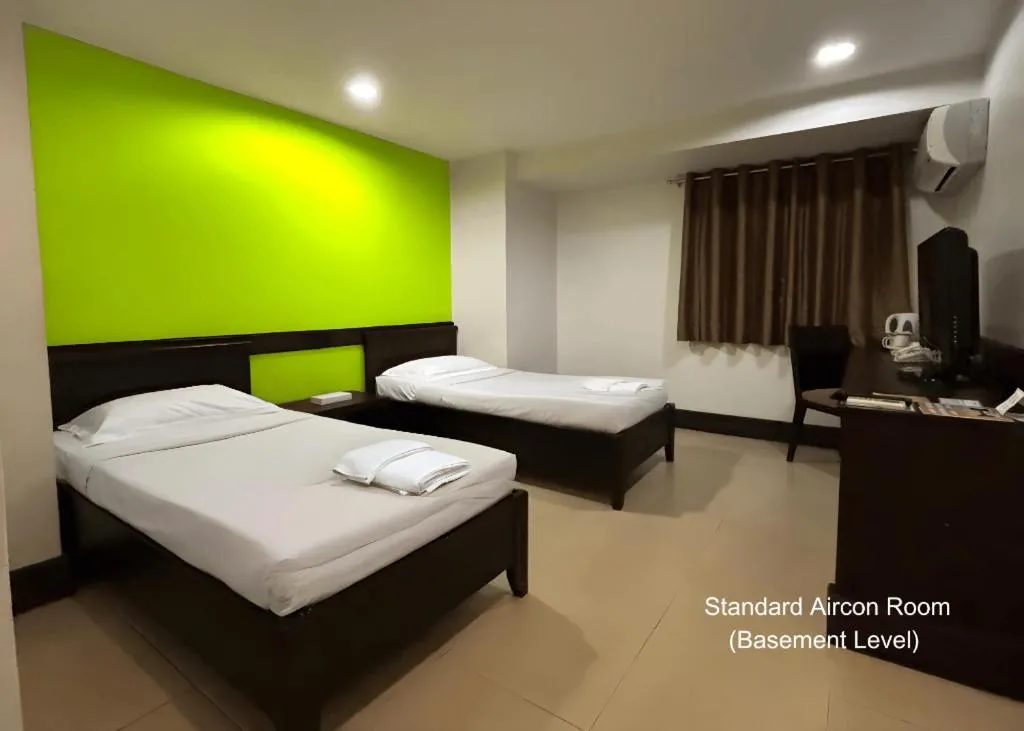 Bed in Citylight Hotel