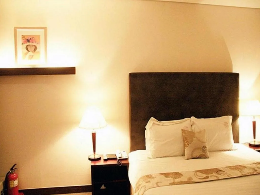 Bed in Hotel Sunshine