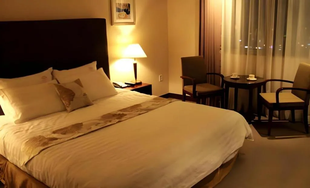 Bed in Hotel Sunshine