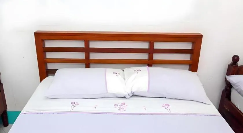 Bed in Palm Grove Saud Holiday Complex Hotel