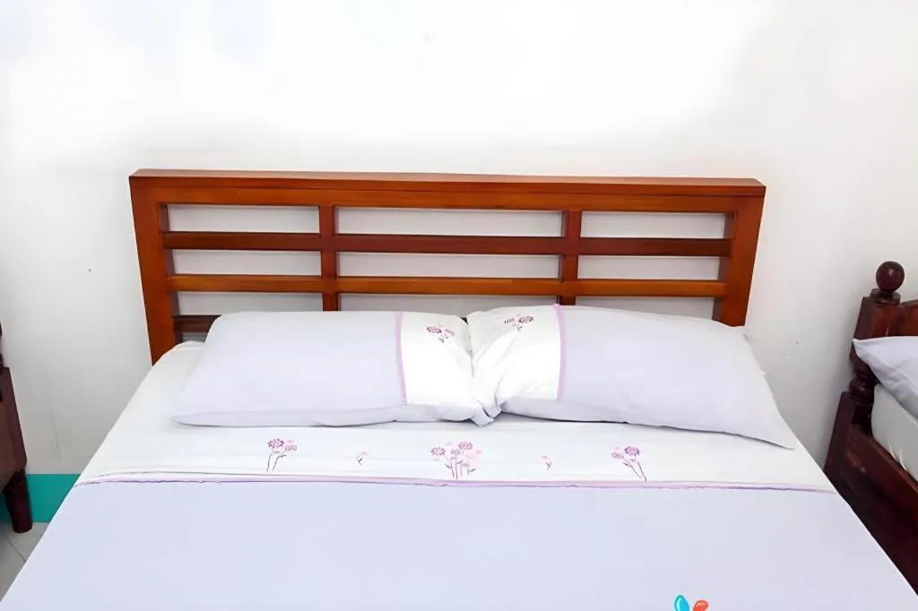 Bed in Palm Grove Saud Holiday Complex Hotel