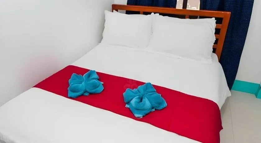 Bed in Palm Grove Saud Holiday Complex Hotel