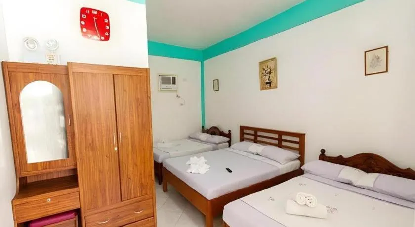 Bed in Palm Grove Saud Holiday Complex Hotel