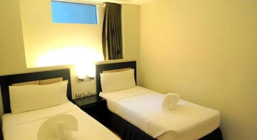 Bed in Mallberry Suites Business Hotel