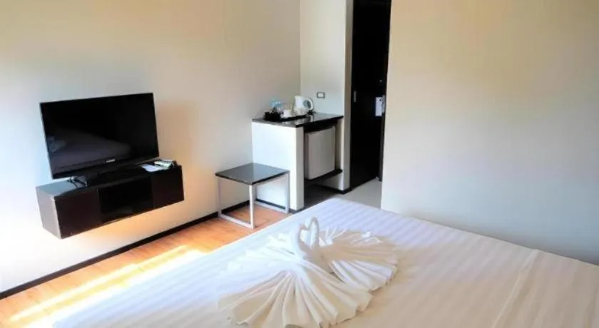 Bed in Mallberry Suites Business Hotel