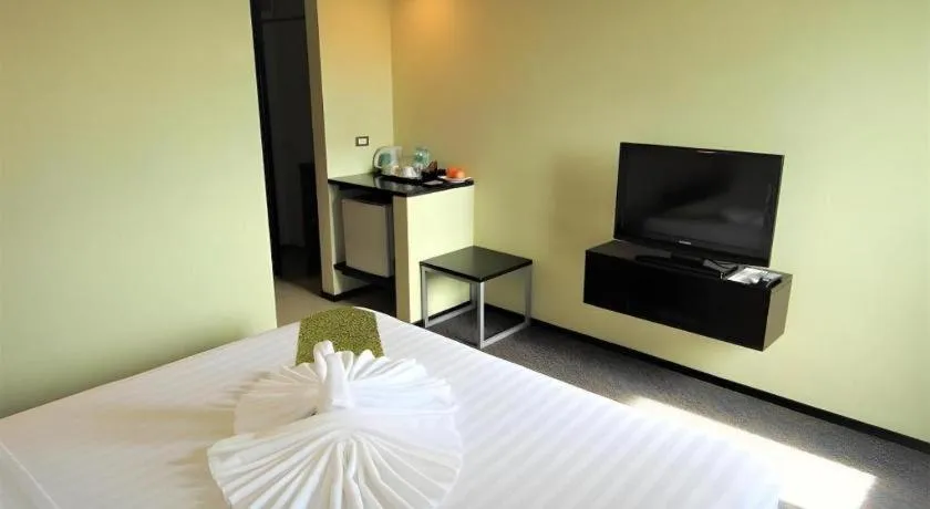 Bed in Mallberry Suites Business Hotel