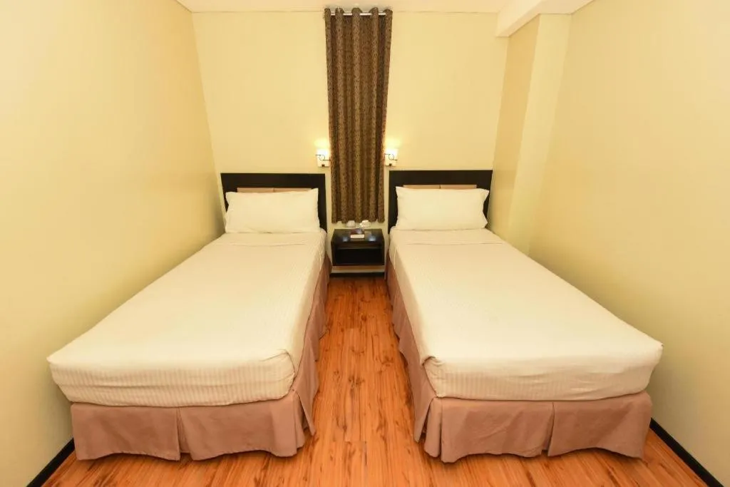Bed in Mallberry Suites Business Hotel