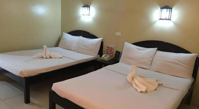 Bed in Sampaguita Suites Plaza Garcia