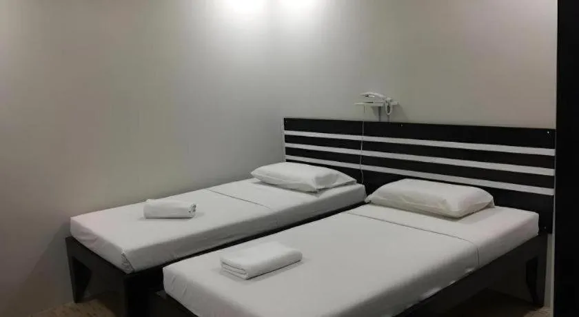 Bed in Sampaguita Suites Plaza Garcia