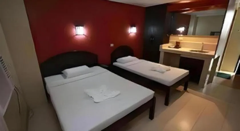 Bed in Sampaguita Suites Plaza Garcia
