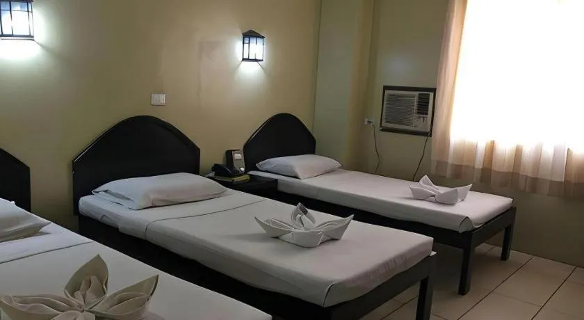 Bed in Sampaguita Suites Plaza Garcia