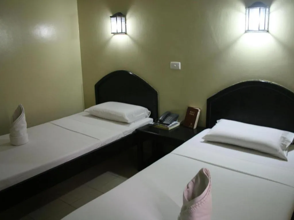 Bed in Sampaguita Suites Plaza Garcia