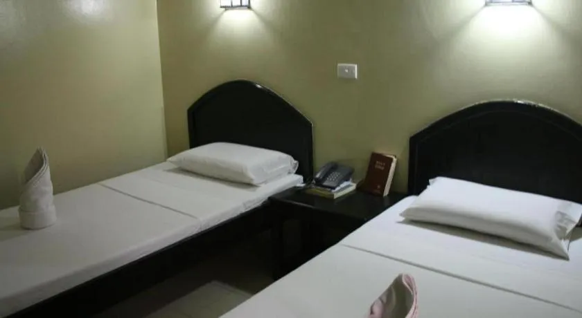 Bed in Sampaguita Suites Plaza Garcia