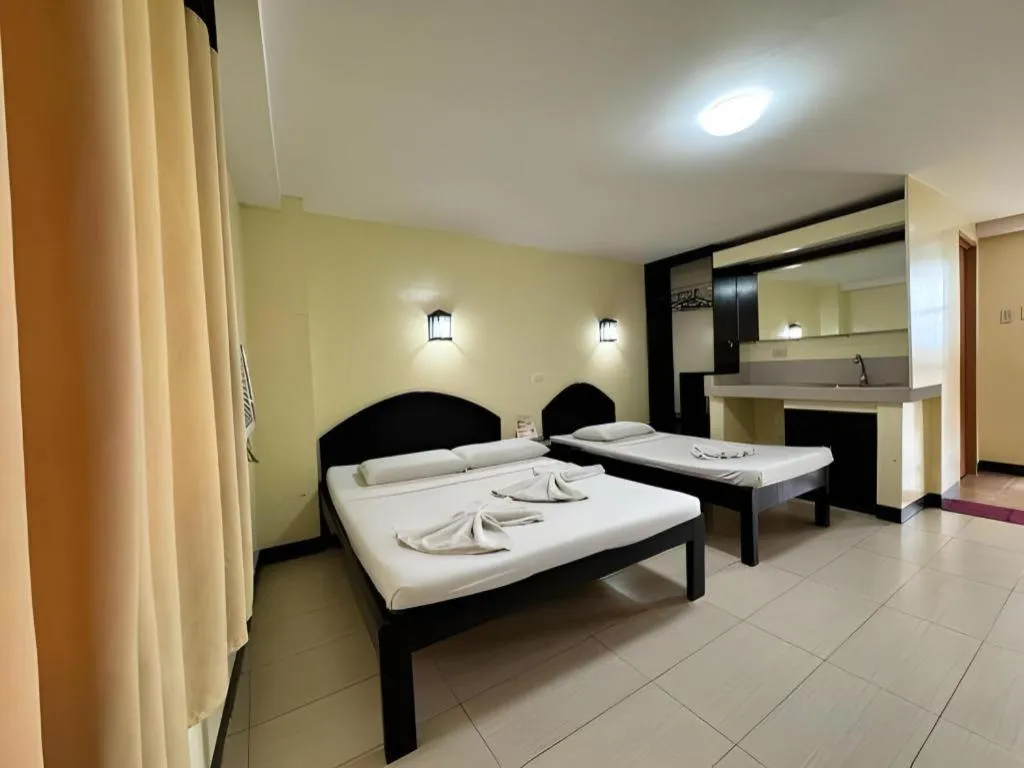 Bed in Sampaguita Suites Plaza Garcia