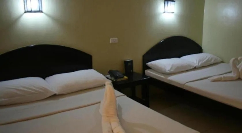 Bed in Sampaguita Suites Plaza Garcia