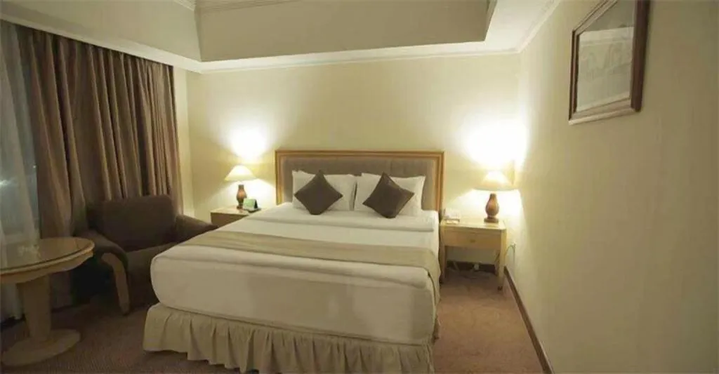 Bed in Oasis Amir Hotel