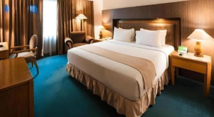 Bed in Oasis Amir Hotel