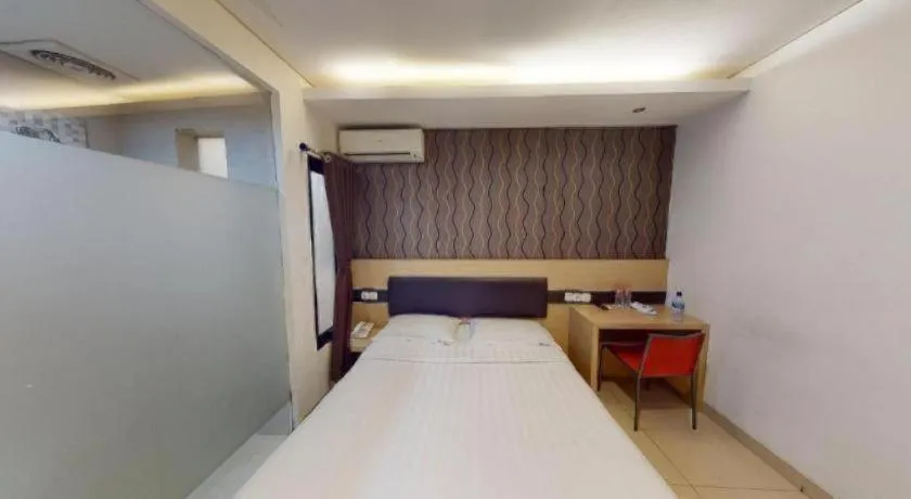 Bed in Sumi Hotel Simpang Lima Semarang