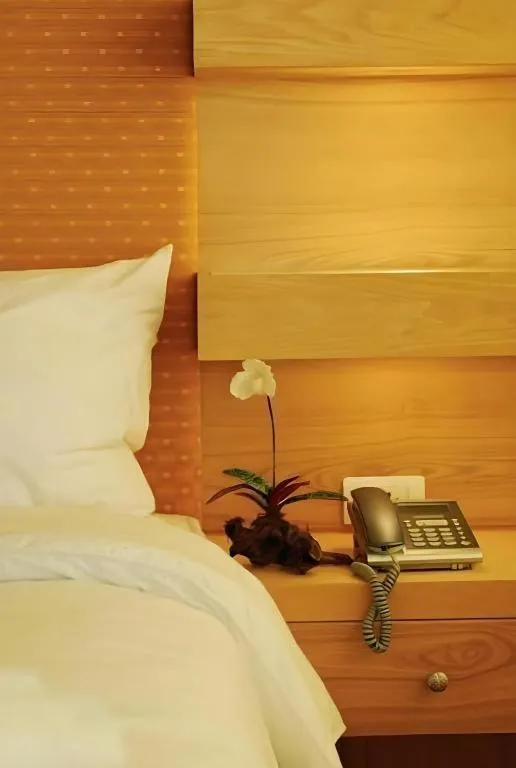 Bed in Western Grand Hotel Ratchaburi