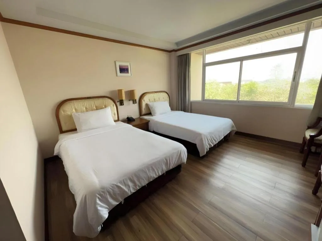 Bed in Western Grand Hotel Ratchaburi