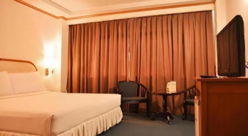 Bed in Western Grand Hotel Ratchaburi