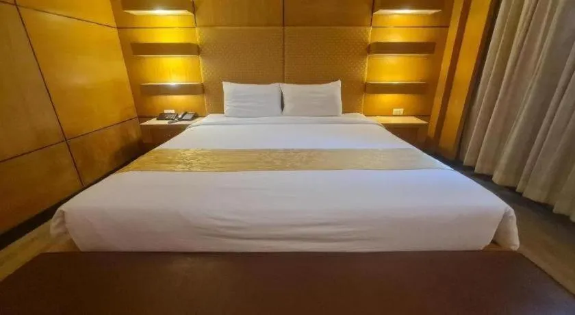 Bed in Western Grand Hotel Ratchaburi