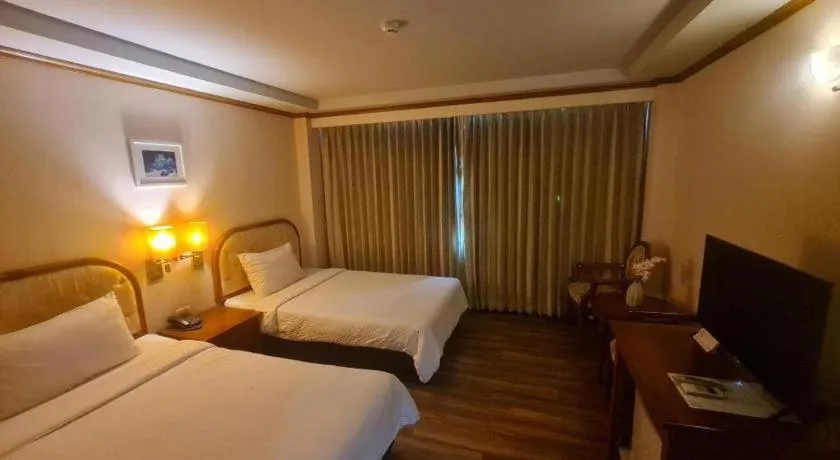Bed in Western Grand Hotel Ratchaburi