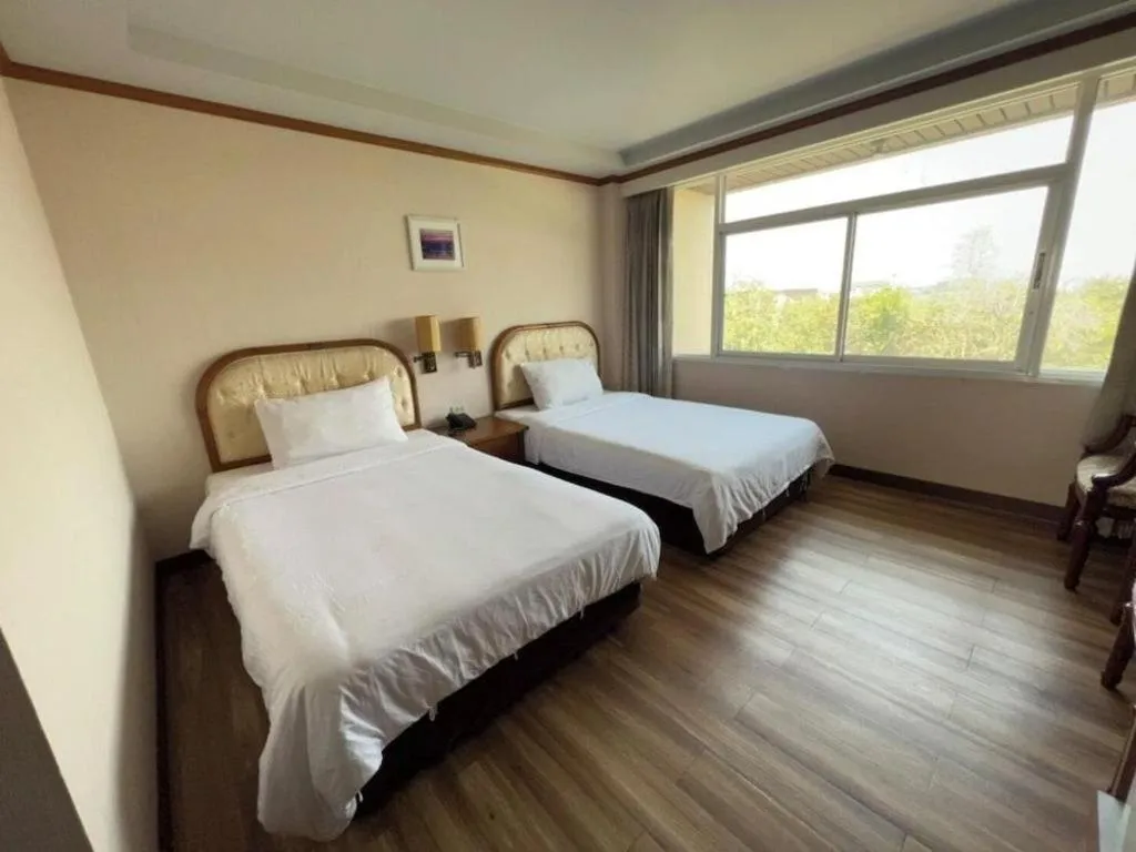 Bed in Western Grand Hotel Ratchaburi