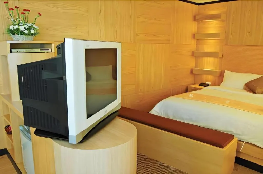 Bed in Western Grand Hotel Ratchaburi